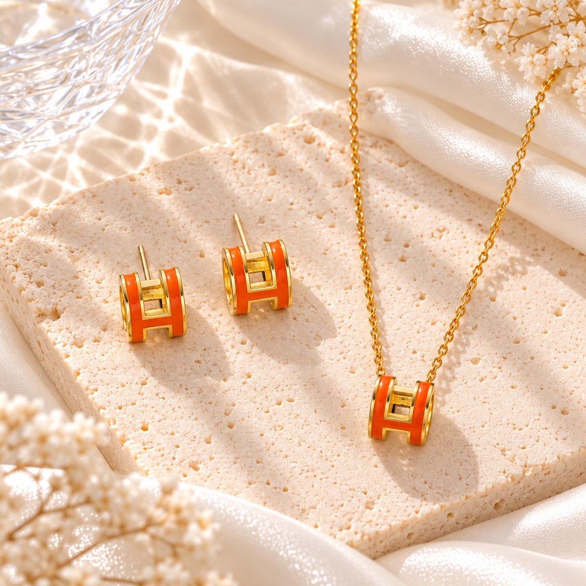orange and gold h set necklace and earrings