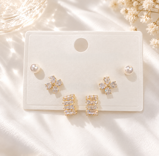 3 pairs of gold earrings