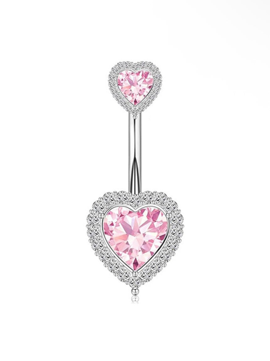 pink and silver belly piercings