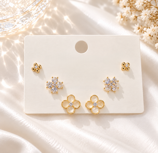 3 pairs of gold earrings