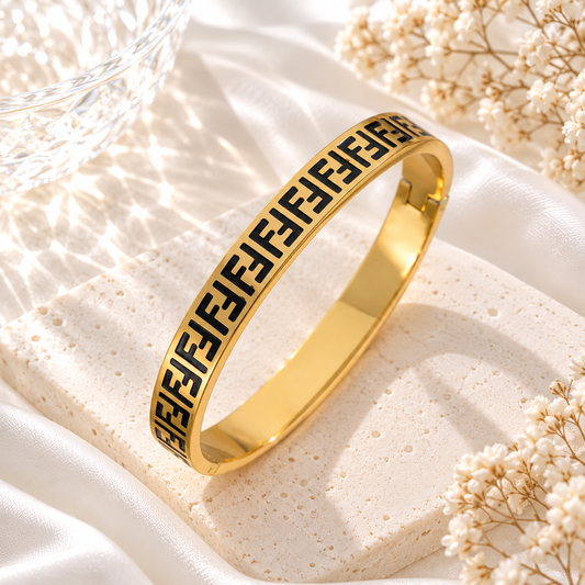 gold and black bangle bracelet